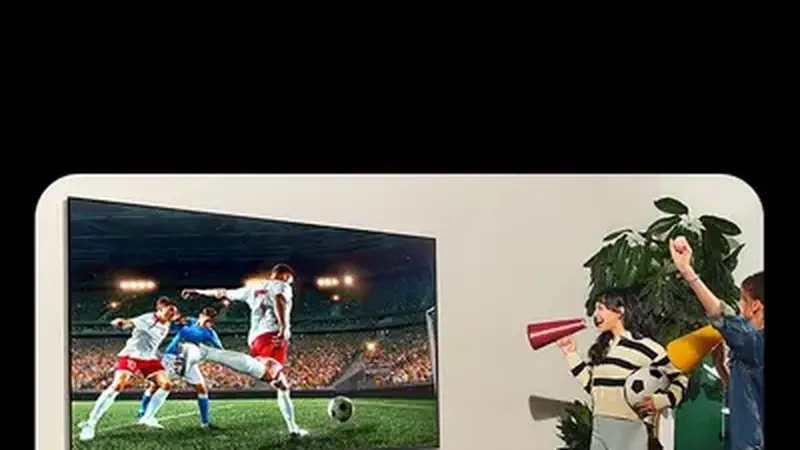 Living room smart TV displaying a football match on a large screen