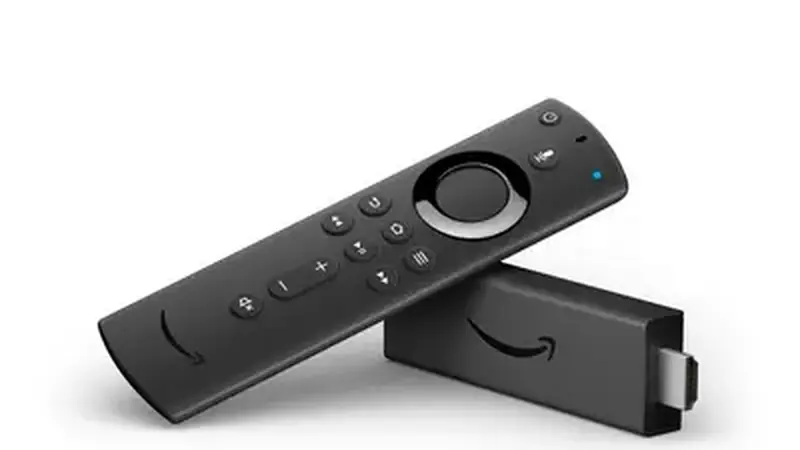 Amazon Fire TV Stick plugged into a television in a living room