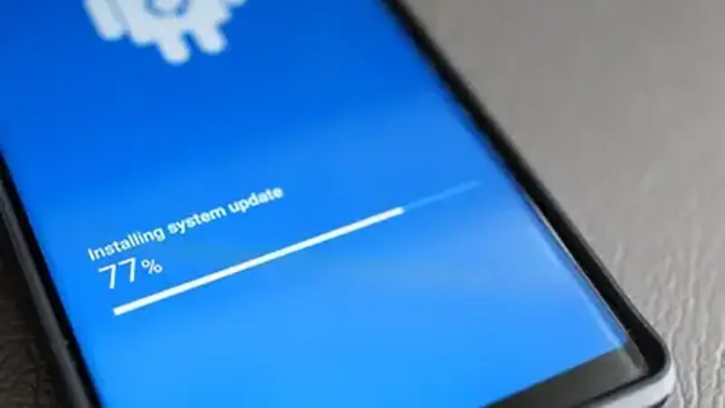Android phone showing a software update screen with progress